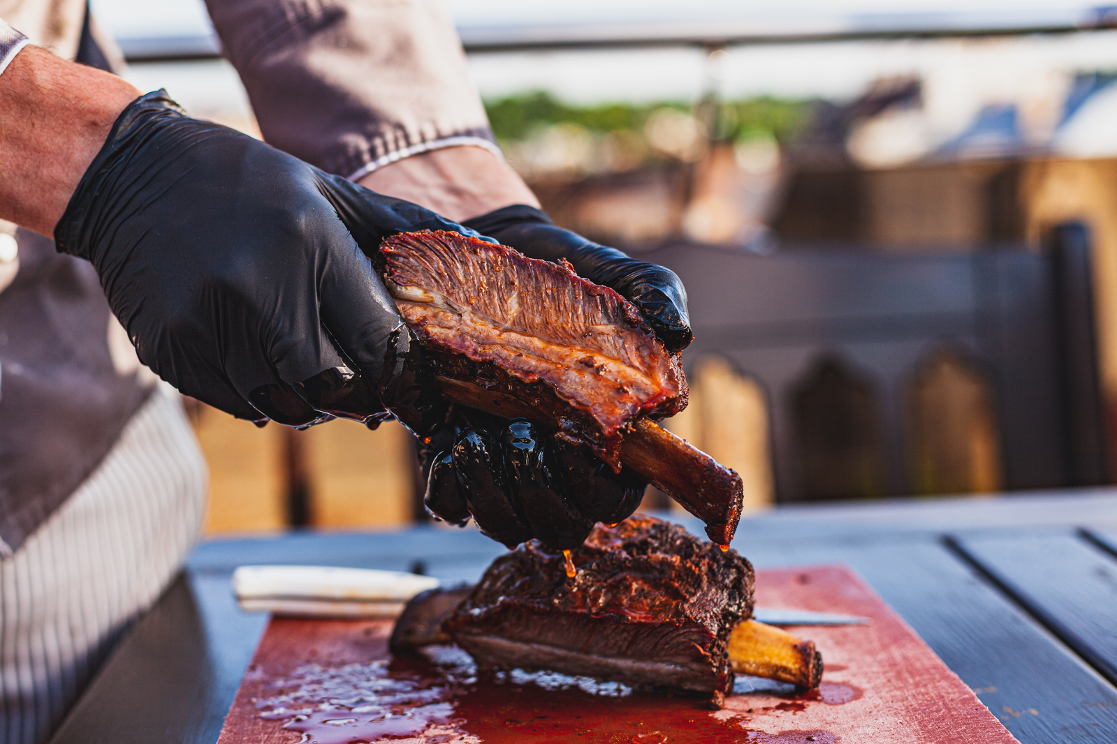 person preparing bbq ribs