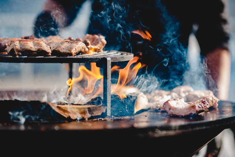 person grilling meat